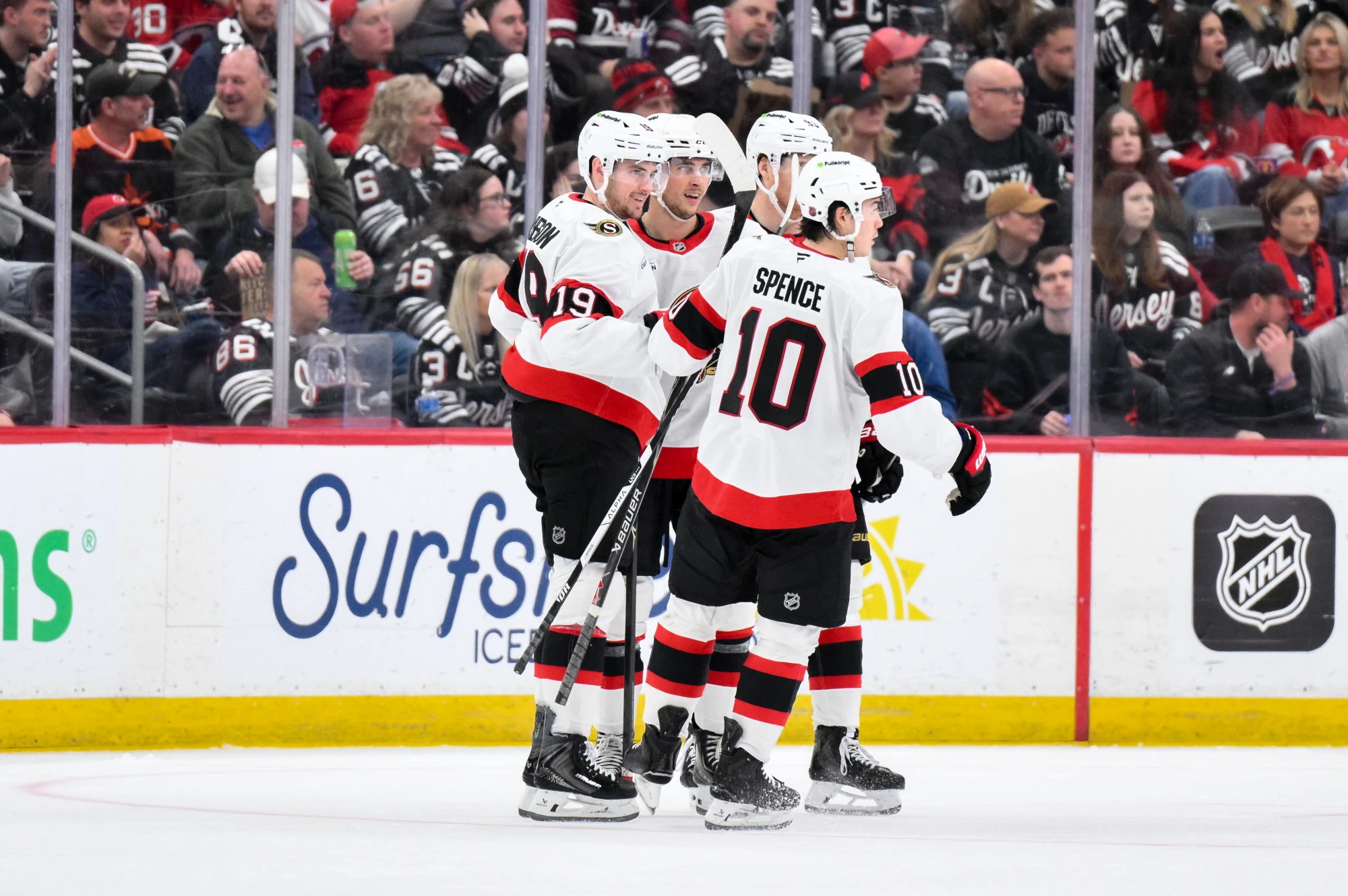 Apr 12, 2026; Newark, New Jersey, USA; Ottawa Senators center Shane Pinto (12) celebrates with teammates after scoring a goal against the New Jersey Devils during the second period at Prudential Center.