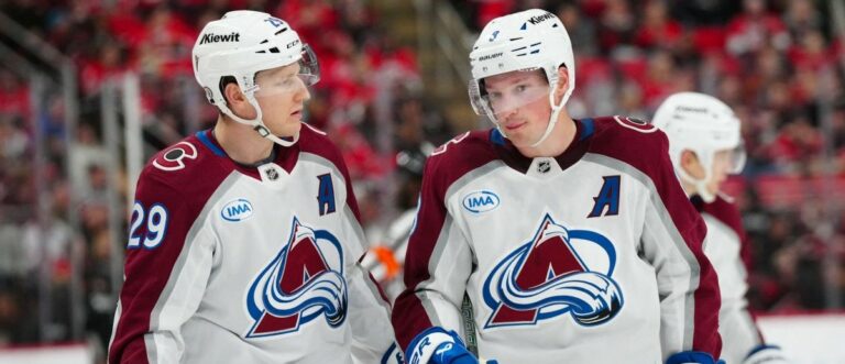 Colorado Avalanche center Nathan MacKinnon (29) and defenseman Cale Makar (8) look on against the Carolina Hurricanes during the third period at Lenovo Center. Mandatory Credit: James Guillory-Imagn Images