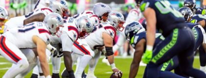 New England Patriots center Garrett Bradbury (65) prepares to snap the ball to quarterback Drake Maye (10) against the Seattle Seahawks during Super Bowl LX at Levi's Stadium.