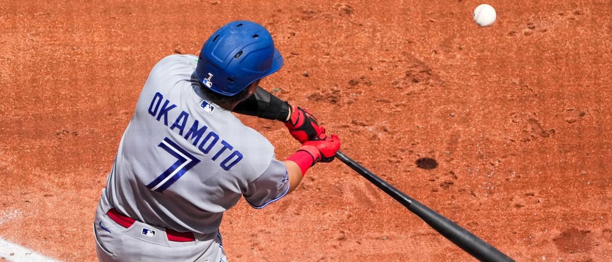 Toronto Blue Jays third baseman Kazuma Okamoto (7) at bat against the Kansas City Royals during the fifth inning at Kauffman Stadium.