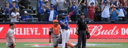 Toronto Blue Jays first baseman Vladimir Guerrero Jr. (27) watches his first home run of the season at Rogers Centre go over the the left field wall during the fifth inning against the Baltimore Orioles. Mandatory Credit: John E. Sokolowski-Imagn Images