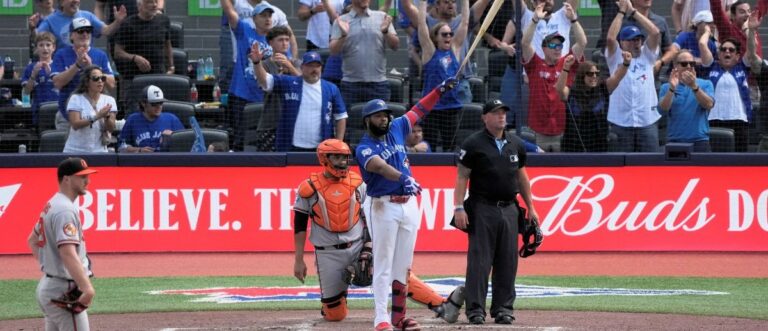Toronto Blue Jays first baseman Vladimir Guerrero Jr. (27) watches his first home run of the season at Rogers Centre go over the the left field wall during the fifth inning against the Baltimore Orioles. Mandatory Credit: John E. Sokolowski-Imagn Images