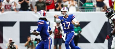 Buffalo Bills quarterback Josh Allen (17) passes the ball to running back James Cook III (4) during the game against the Houston Texans at Reliant Stadium. Mandatory Credit: Troy Taormina-Imagn Images