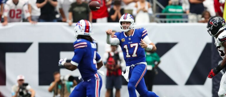 Buffalo Bills quarterback Josh Allen (17) passes the ball to running back James Cook III (4) during the game against the Houston Texans at Reliant Stadium. Mandatory Credit: Troy Taormina-Imagn Images