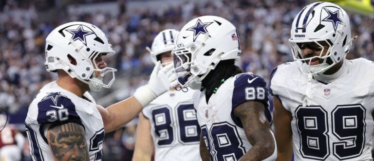 Dallas Cowboys wide receiver CeeDee Lamb (88) celebrates with tight end Brevyn Spann-Ford (89) and fullback Hunter Luepke (30) after catching a three-yard touchdown pass thrown by quarterback Dak Prescott (not pictured) against the Washington Commanders during the first quarter at AT&T Stadium. Mandatory Credit: Kevin Jairaj-Imagn Images