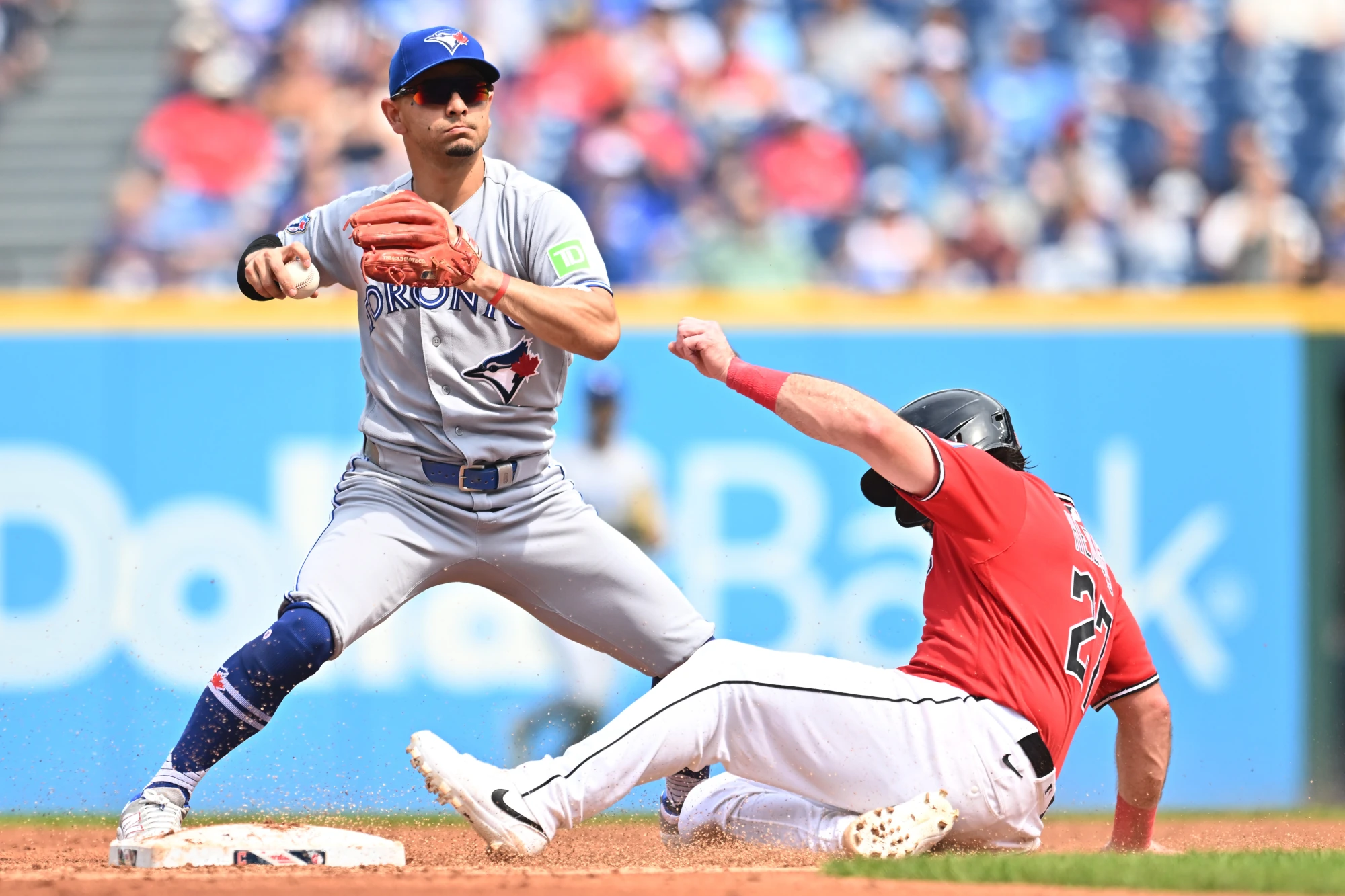 Sep 3, 2026; Cleveland, Ohio, USA; Toronto Blue Jays shortstop Andres Gimenez (0) forces out Cleveland Guardians catcher Austin Hedges (27) during the second inning at Progressive Field.