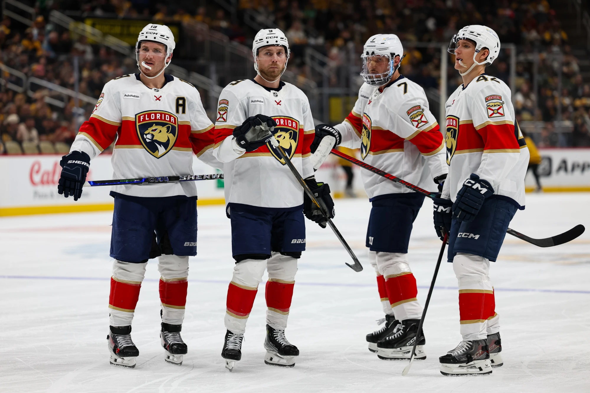 Florida Panthers left wing Matthew Tkachuk (19), Florida Panthers center Sam Bennett (9), Florida Panthers defenseman Dmitry Kulikov (7), and Florida Panthers defenseman Gustav Forsling (42) look on against the Pittsburgh Penguins during the second period at PPG Paints Arena. Apr 5, 2026; Pittsburgh, Pennsylvania, USA.