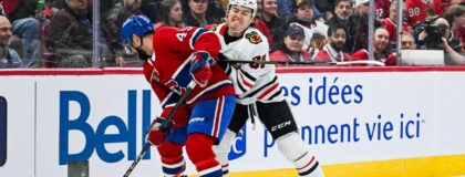 Chicago Blackhawks center Connor Bedard (98) checks Montreal Canadiens defenseman Alexandre Carrier (45) in the first period at Bell Centre. Mandatory Credit: David Kirouac-Imagn Images