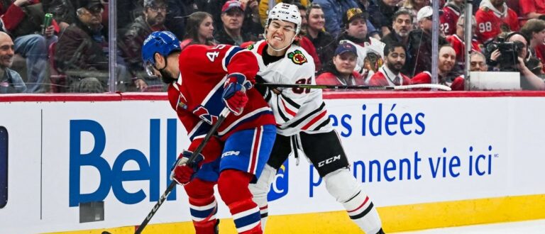 Chicago Blackhawks center Connor Bedard (98) checks Montreal Canadiens defenseman Alexandre Carrier (45) in the first period at Bell Centre. Mandatory Credit: David Kirouac-Imagn Images