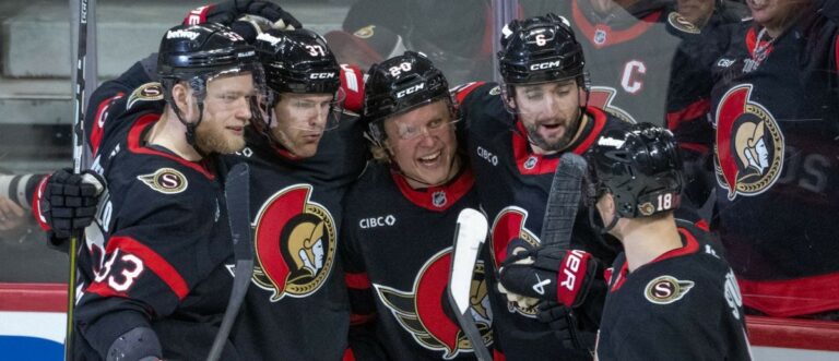 Ottawa Senators left wing Warren Foegele (37) celebrates with defenseman Nikolas Matinpalo (33)andleft wing Fabian Zetterlund (20) and defenseman Dennis Gilbert (6) and center Tim Stutzle (18) his goal scored in the third period against the New York Islanders at the Canadian Tire Centre. Mandatory Credit: Marc DesRosiers-IMAGN Images