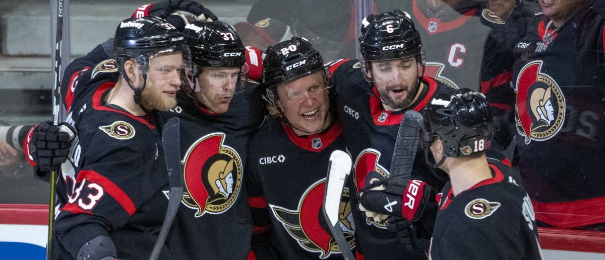 Ottawa Senators left wing Warren Foegele (37) celebrates with defenseman Nikolas Matinpalo (33)andleft wing Fabian Zetterlund (20) and defenseman Dennis Gilbert (6) and center Tim Stutzle (18) his goal scored in the third period against the New York Islanders at the Canadian Tire Centre. Mandatory Credit: Marc DesRosiers-IMAGN Images