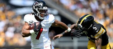 Atlanta Falcons running back Bijan Robinson (7) scores a touchdown against Pittsburgh Steelers cornerback Jalen Ramsey (5) during the first quarter at Acrisure Stadium. Mandatory Credit: Barry Reeger-Imagn Images