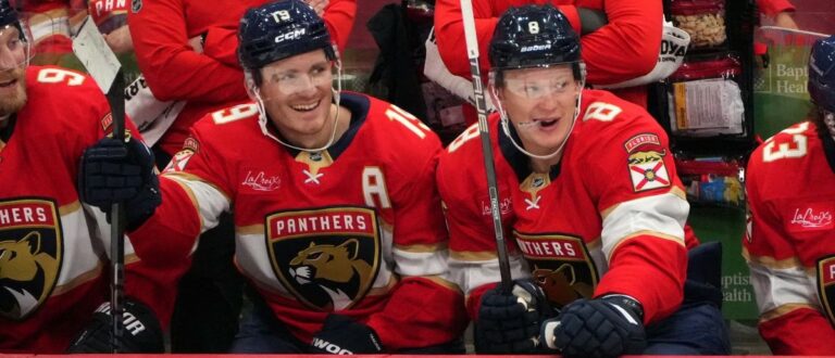 Florida Panthers left wing Matthew Tkachuk (19) and his brother, left wing Brady Tkachuk (8), sit on the bench during the third period against the Carolina Hurricanes at Amerant Bank Arena. Mandatory Credit: Jim Rassol-Imagn Images