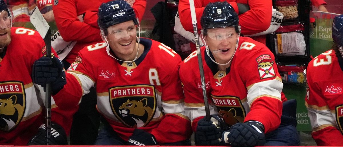 Florida Panthers left wing Matthew Tkachuk (19) and his brother, left wing Brady Tkachuk (8), sit on the bench during the third period against the Carolina Hurricanes at Amerant Bank Arena. Mandatory Credit: Jim Rassol-Imagn Images