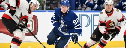 Toronto Maple Leafs forward Gavin McKenna (92) is tripped by the stick of Ottawa Senators forward Philippe Daoust (92) as forward Kasperi Halttunen (68) skates by in the third period at Scotiabank Arena. Mandatory Credit: Dan Hamilton-Imagn Images