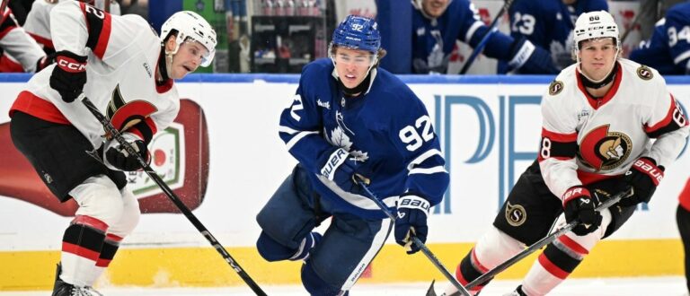 Toronto Maple Leafs forward Gavin McKenna (92) is tripped by the stick of Ottawa Senators forward Philippe Daoust (92) as forward Kasperi Halttunen (68) skates by in the third period at Scotiabank Arena. Mandatory Credit: Dan Hamilton-Imagn Images