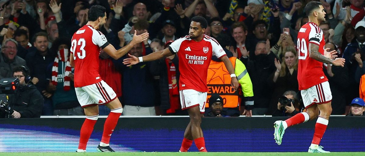 UEFA Champions League - Arsenal v Lille - Emirates Stadium, London, Britain - October 13, 2026 Arsenal's Jurrien Timber celebrates scoring their first goal with Mikel Merino REUTERS/Hannah Mckay