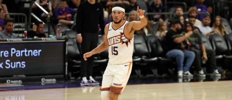Phoenix Suns guard Devin Booker (15) points after scoring against the Utah Jazz in the second half at Mortgage Matchup Center. Mandatory Credit: Anna Carrington-Imagn Images