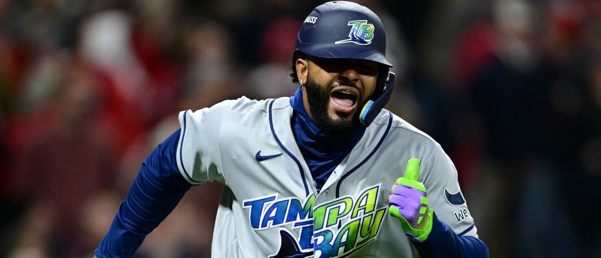 Tampa Bay Rays infielder Junior Caminero (13) runs and reacts after hitting an RBI double to left field against Cleveland Guardians pitcher Daniel Espino (not pictured) during the sixth inning in game four of the ALCS for the 2026 MLB Playoffs at Progressive Field. Mandatory Credit: David Dermer-Imagn Images