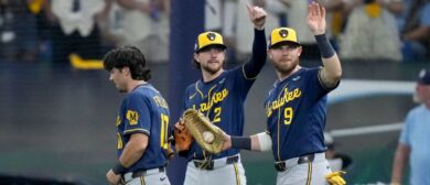 Milwaukee Brewers players Brice Turang (2) and Jake Bauers (9) signal that Milwaukee Brewers right fielder Sal Frelick (10) is okay after making a diving catch against the Tampa Bay Rays during the eighth inning during Game 3 of the World Series at Tropicana Field in St. Petersburg, Fla. on Oct 26, 2026