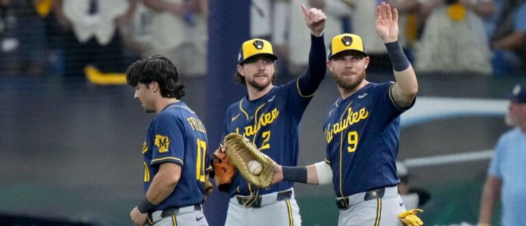 Milwaukee Brewers players Brice Turang (2) and Jake Bauers (9) signal that Milwaukee Brewers right fielder Sal Frelick (10) is okay after making a diving catch against the Tampa Bay Rays during the eighth inning during Game 3 of the World Series at Tropicana Field in St. Petersburg, Fla. on Oct 26, 2026