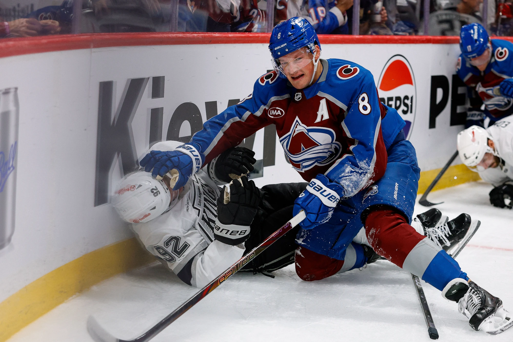 Sep 30, 2026; Denver, Colorado, USA; Colorado Avalanche defenseman Cale Makar (8) pushes Los Angeles Kings defenseman Brandt Clarke (92) after a play in the second period at Ball Arena.